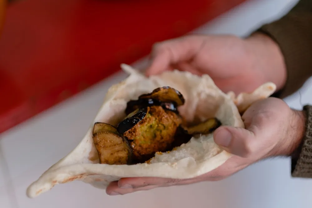 Falafel wrap, opened to show the filling