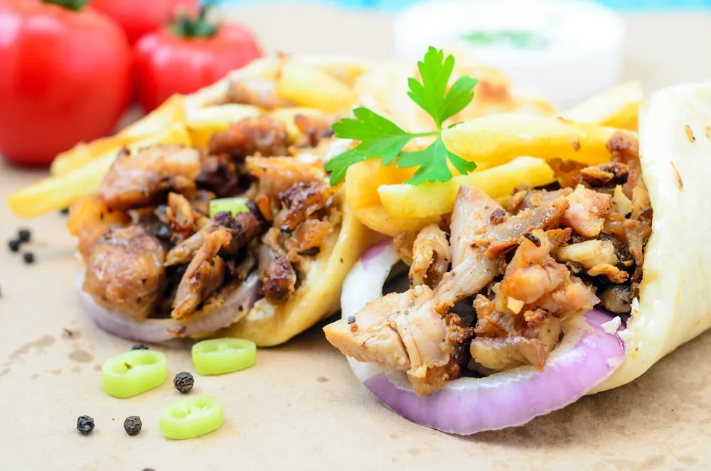 Shawarma wrap sliced open, showing the grilled filling