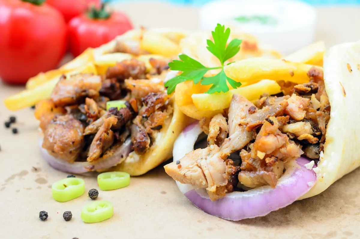 Shawarma wrap sliced open, showing the grilled filling